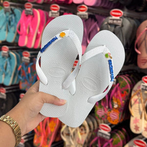 Havaianas Top +  Placa Logo + Pin Sol e Água de Coco